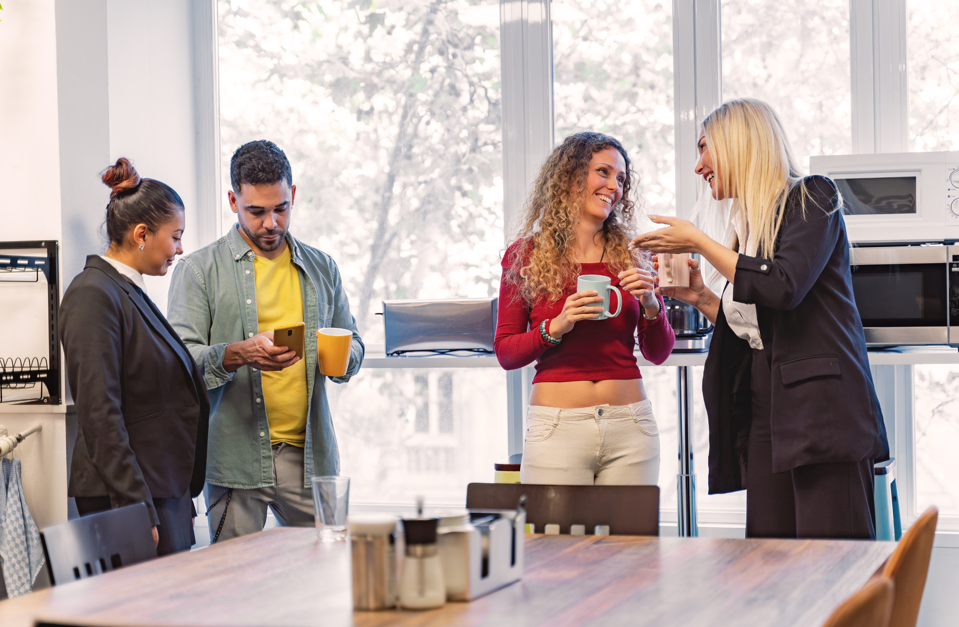 coworkers enjoying coffee in the breakroom